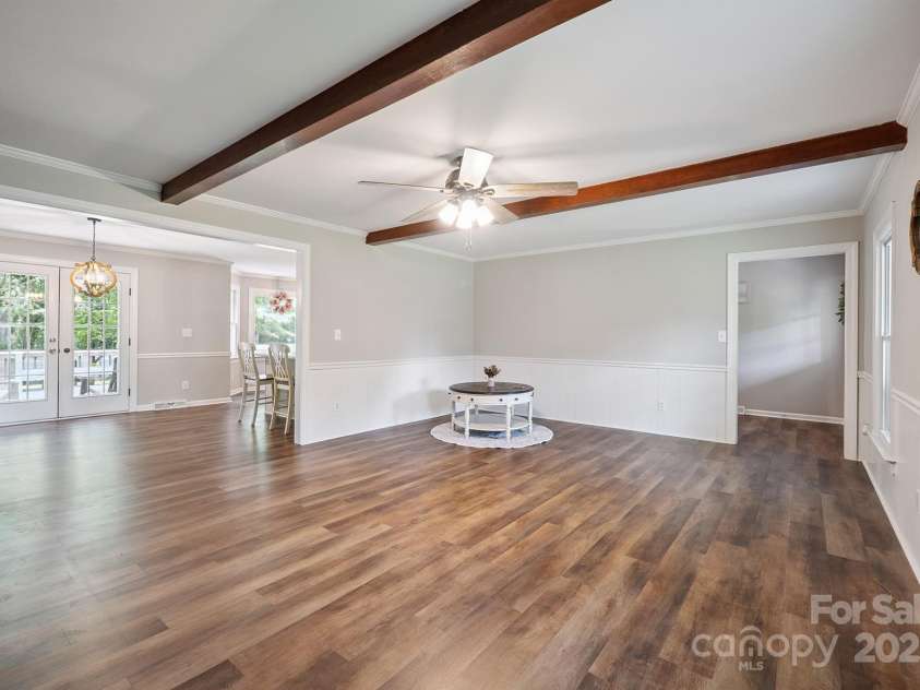 10206 Washam Potts Road, Cornelius, NC 28031.  MLS# CAR4273009, YatesRealty ID 25825. Living Room with fireplace and built-in bookshelves and storage