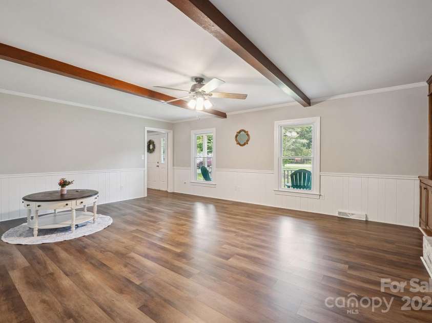 10206 Washam Potts Road, Cornelius, NC 28031.  MLS# CAR4273009, YatesRealty ID 25825. Living Room with fireplace and built-in bookshelves and storage