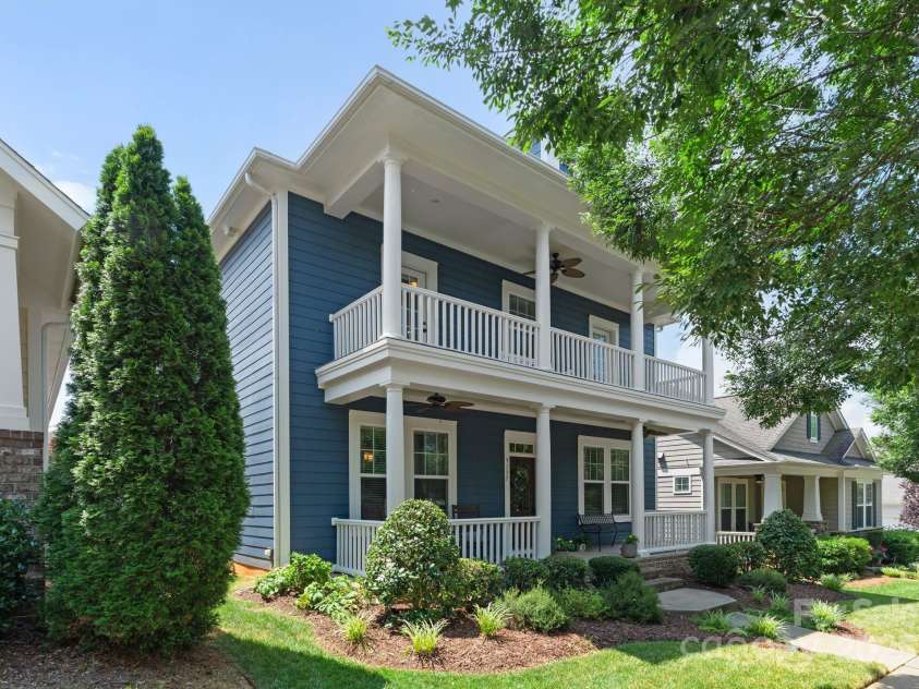5137 Rialto Street, Belmont, NC 28012.  MLS# CAR4277416, YatesRealty ID 25831. Welcoming and charming, the front of this beautiful home features two spacious covered porches that invite you to sit back and enjoy the neighborhood’s peaceful ambiance. These thoughtfully designed porches not only enhan