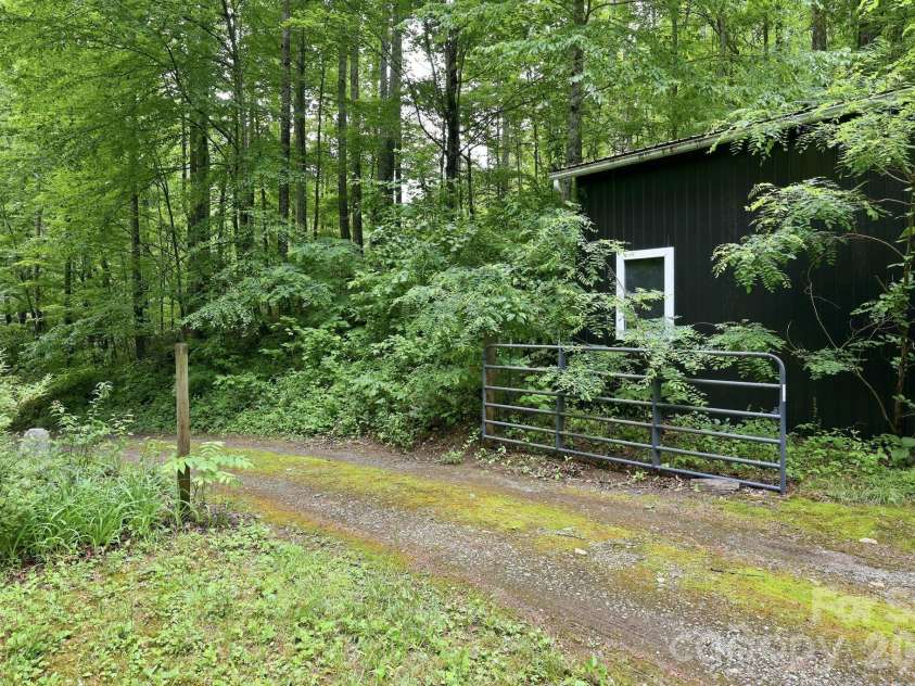 182 Saw Branch Road, Candler, NC 28715.  MLS# CAR4386375, YatesRealty ID 25834. 