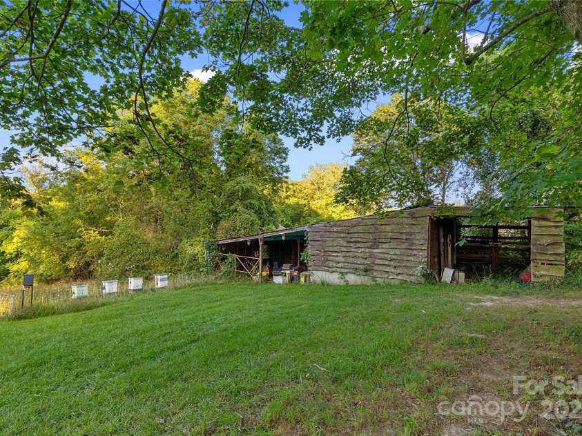 163 Pisgah View Road, Asheville, NC 28806.  MLS# CAR4294494, YatesRealty ID 2584. Old barn/storage shed in back field 