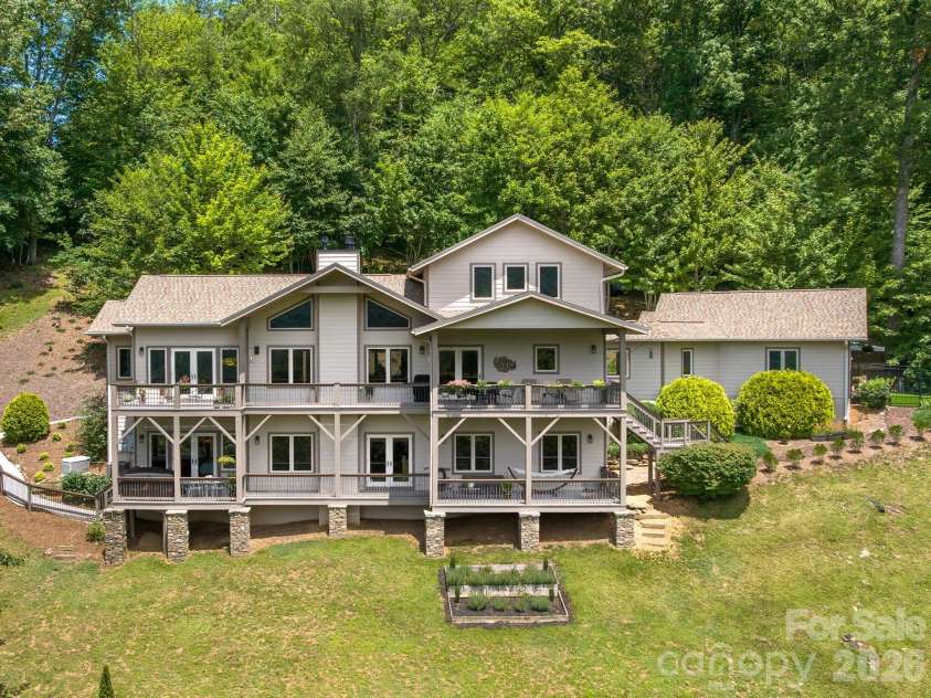 37 Enclave Drive, Waynesville, NC 28786.  MLS# CAR4329096, YatesRealty ID 2584. Elevated mountain living with expansive covered decks.