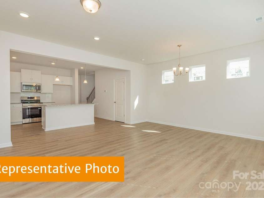 6041 Jasmine Branch Road, Charlotte, NC 28216.  MLS# CAR4333908, YatesRealty ID 2585. Suwanee Dining and Family Room