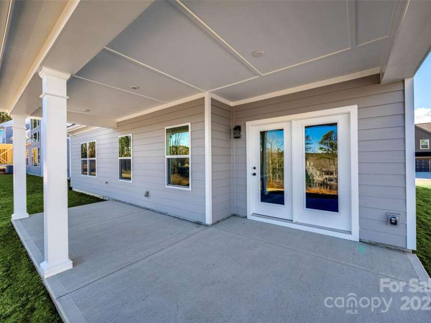 18011 Wilbanks Drive, Charlotte, NC 28278.  MLS# CAR4256574, YatesRealty ID 25857. Covered patio—this backyard was made for entertaining or quiet evenings outside.