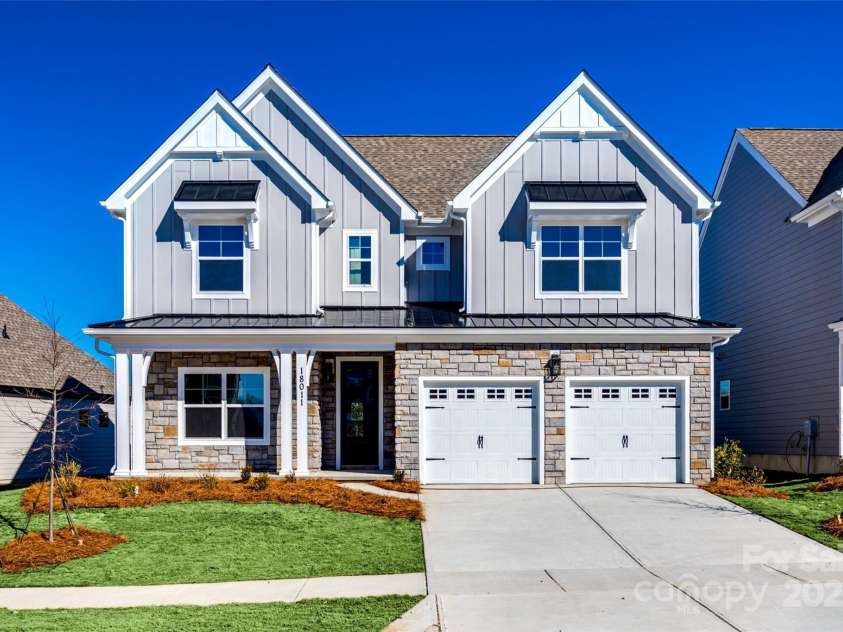 18011 Wilbanks Drive, Charlotte, NC 28278.  MLS# CAR4256574, YatesRealty ID 25857. Curb appeal perfection! This beautiful two-story home blends craftsman charm with modern finishes and a welcoming front porch