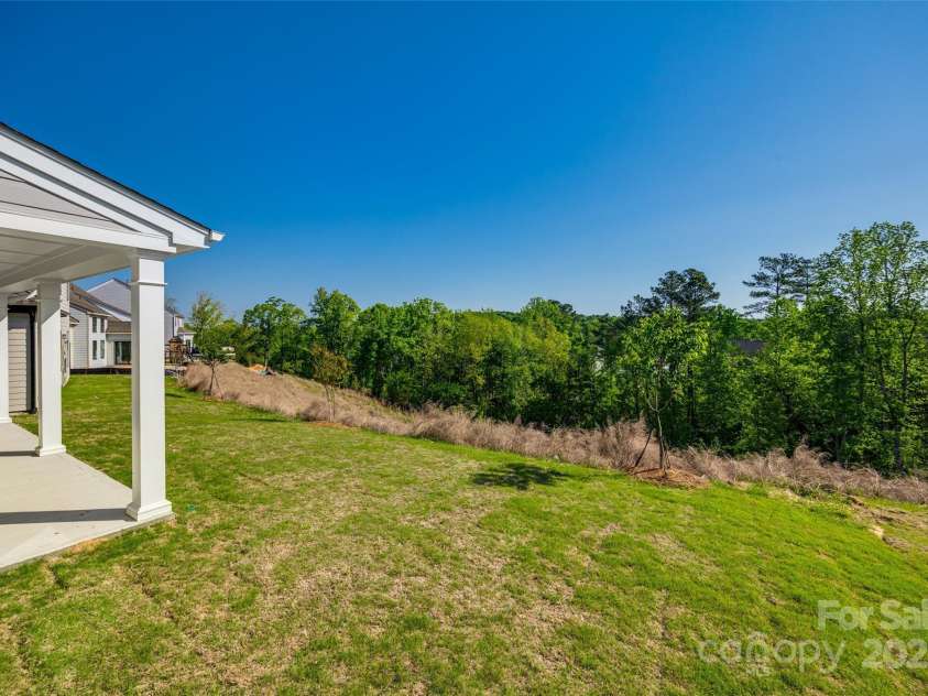 18011 Wilbanks Drive, Charlotte, NC 28278.  MLS# CAR4256574, YatesRealty ID 25857. Enjoy privacy and open green space—no rear neighbors and endless potential for outdoor living.