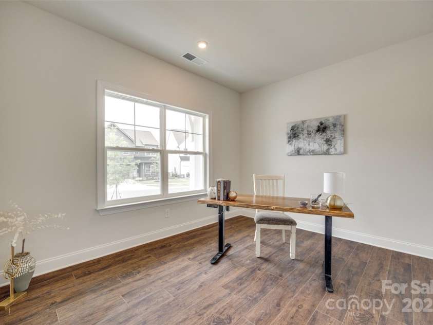 18011 Wilbanks Drive, Charlotte, NC 28278.  MLS# CAR4256574, YatesRealty ID 25857. Light-filled and stylish, this dedicated office offers the ideal setup for remote work or a creative retreat.