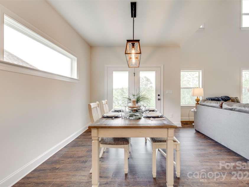 18011 Wilbanks Drive, Charlotte, NC 28278.  MLS# CAR4256574, YatesRealty ID 25857. Light-filled dining area with modern fixture and open flow.