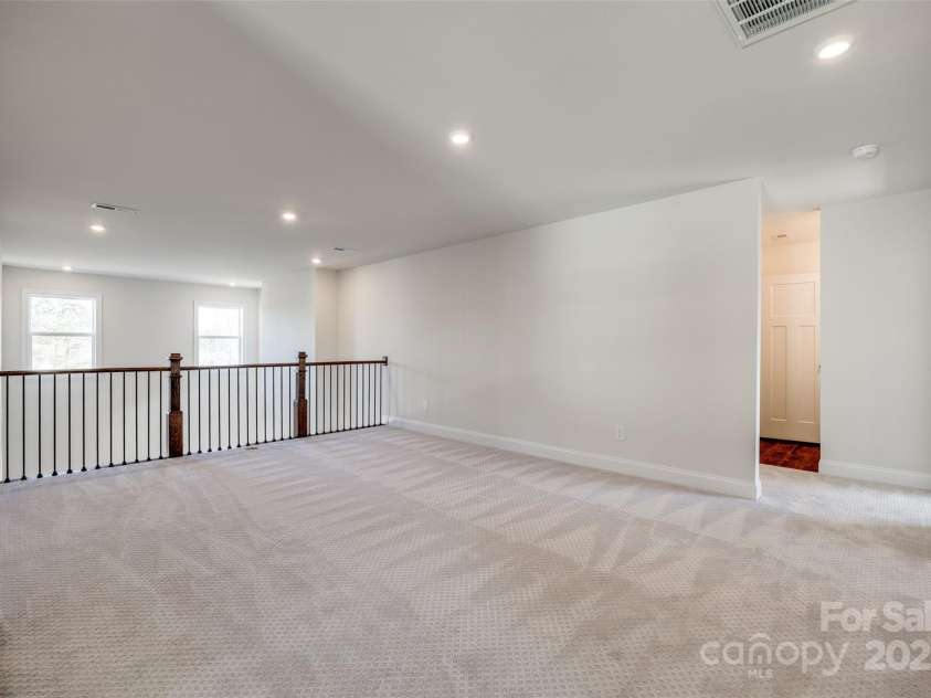18011 Wilbanks Drive, Charlotte, NC 28278.  MLS# CAR4256574, YatesRealty ID 25857. Spacious upstairs loft—perfect for a media room, playroom, or home office.