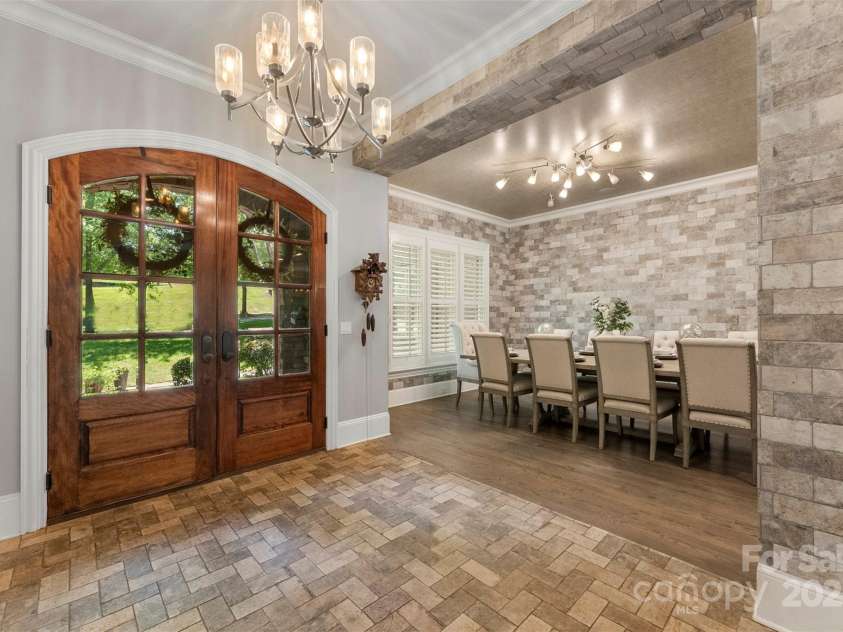 10007 Hillspring Drive, Huntersville, NC 28078.  MLS# CAR4272682, YatesRealty ID 25864. Grand entryway features arched solid wood double doors for a warm and stately welcome
