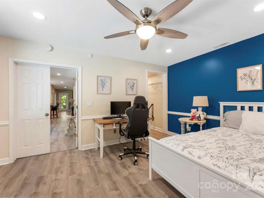 10007 Hillspring Drive, Huntersville, NC 28078.  MLS# CAR4272682, YatesRealty ID 25864. Private lower-level primary suite with dedicated entrance, perfect for guests or extended family