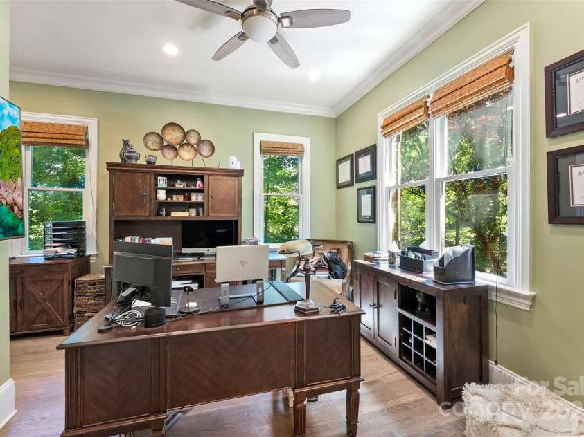 10007 Hillspring Drive, Huntersville, NC 28078.  MLS# CAR4272682, YatesRealty ID 25864. Spacious home office with French doors that open directly to the screened porch for indoor-outdoor inspiration.