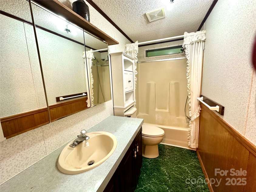 572 Blue Ridge Gem Stone Road, Spruce Pine, NC 28777.  MLS# CAR4279769, YatesRealty ID 25866. Guest Bath