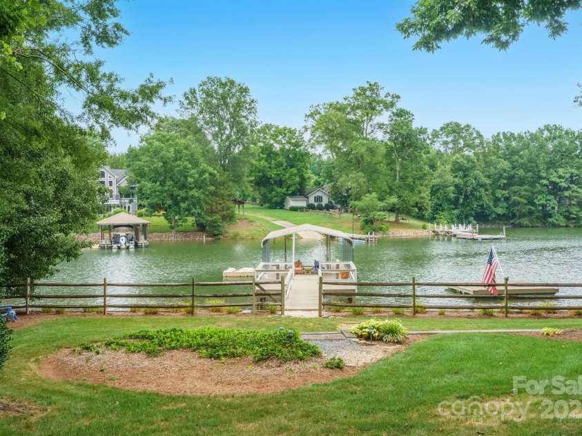 232 Elysian Drive, Mooresville, NC 28117.  MLS# CAR4275042, YatesRealty ID 25874. Gentle slope to the water