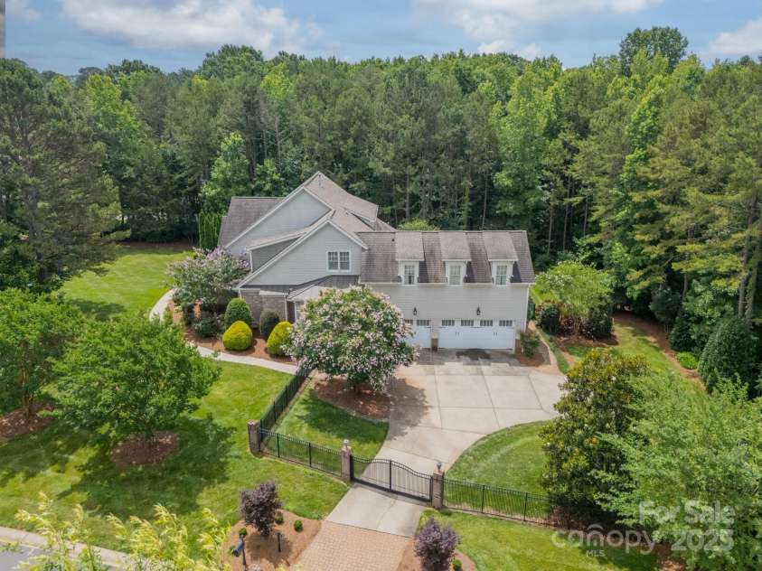 9202 Arlington Hills Drive, Mint Hill, NC 28227.  MLS# CAR4262986, YatesRealty ID 25878. Aerial view of property w/ 3 car garage