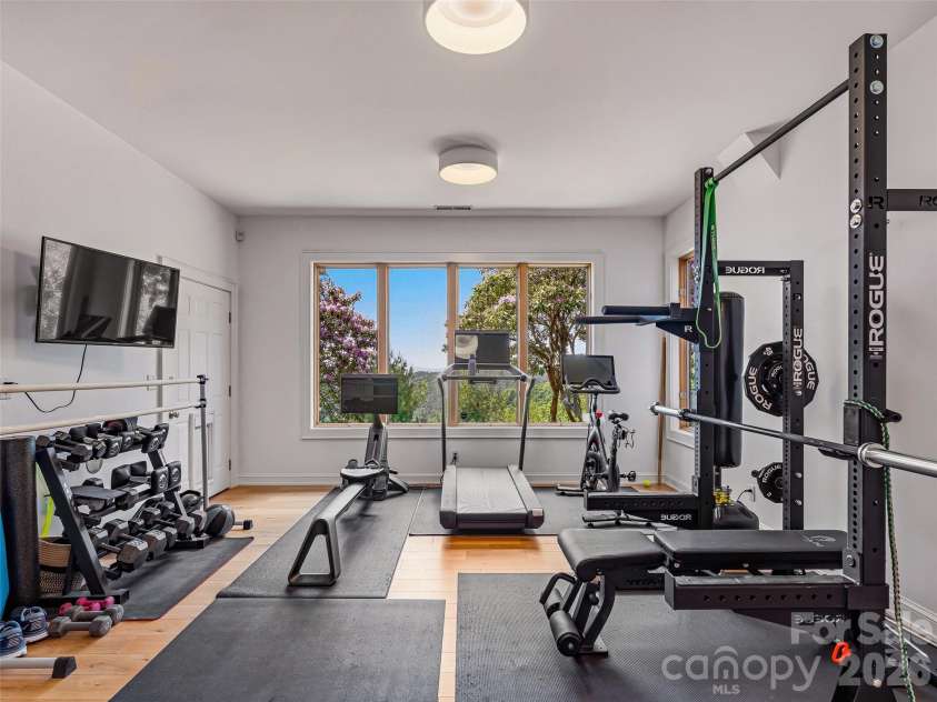 100 Big Spring Drive, Asheville, NC 28804.  MLS# CAR4375270, YatesRealty ID 25890. Large flex space provides limitless options to fit your needs. An adjacent half bath makes it the perfect place for an additional bedroom, home office, home gym, art studio, and the list goes on...