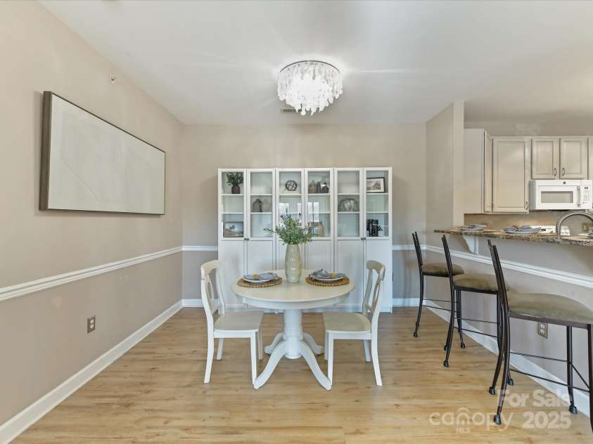 19763 Deer Valley Drive, Cornelius, NC 28031.  MLS# CAR4333063, YatesRealty ID 25893. Dining area with custom chandelier!