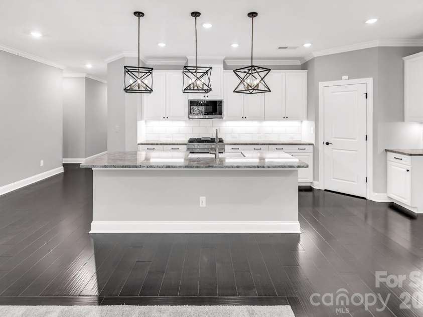 4097 Canopy Creek Drive, Denver, NC 28037.  MLS# CAR4373719, YatesRealty ID 25897. Kitchen with huge island all overlooking the Great Room