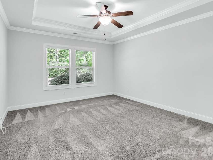 4097 Canopy Creek Drive, Denver, NC 28037.  MLS# CAR4373719, YatesRealty ID 25897. Primary Bedroom with Tray Ceiling & Enhanced Crown Molding