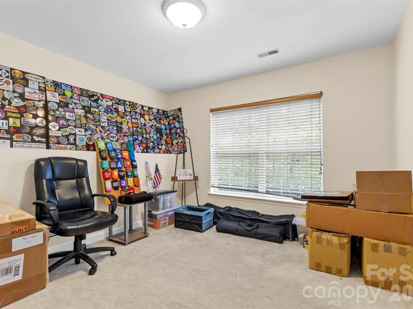 7710 Ninth Fairway Lane, Mint Hill, NC 28227.  MLS# CAR4382520, YatesRealty ID 25898. Basement office area