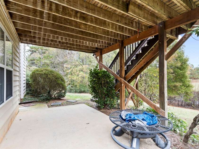 7710 Ninth Fairway Lane, Mint Hill, NC 28227.  MLS# CAR4382520, YatesRealty ID 25898. Patio through walkout basement
