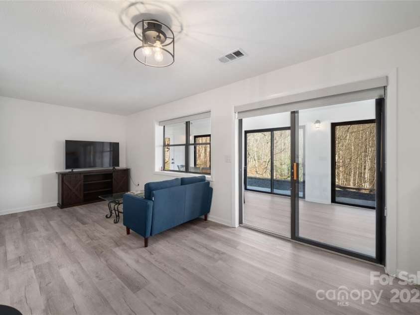 158 Blackberry Lane, Maggie Valley, NC 28751.  MLS# CAR4242897, YatesRealty ID 259. 2nd Quarters Lower Level Living Room