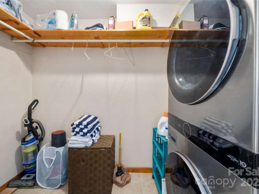158 Blackberry Lane, Maggie Valley, NC 28751.  MLS# CAR4242897, YatesRealty ID 259. Laundry in Primary Bedroom Closet