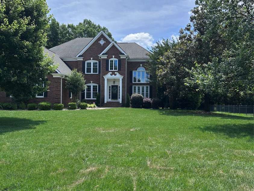 9205 Belmont Lane, Waxhaw, NC 28173.  MLS# CAR4381231, YatesRealty ID 25906. Front elevation and yard