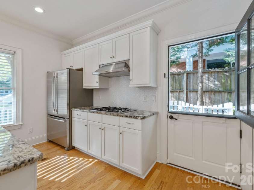 2060 Euclid Avenue, Charlotte, NC 28203.  MLS# CAR4364352, YatesRealty ID 25907. Side Dutch Door to private patio