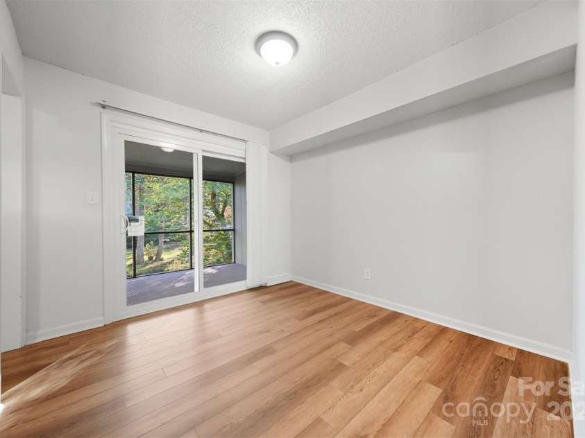 824 6th Street, Hickory, NC 28601.  MLS# CAR4313631, YatesRealty ID 25907. Office with sliding glass doors to screened porch overlooking the creek.  