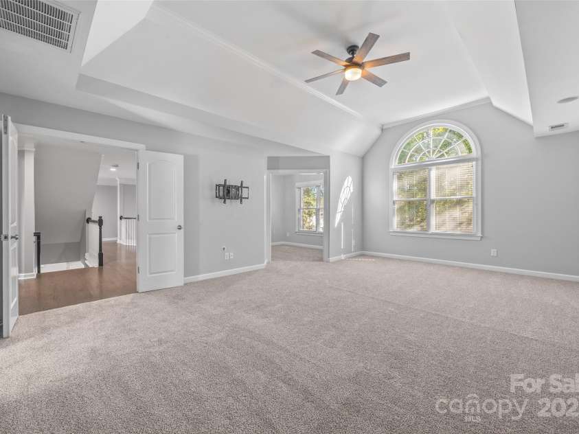 7146 Harcourt Crossing, Indian Land, SC 29707.  MLS# CAR4313502, YatesRealty ID 25914. Primary Bedroom w/ sitting area facing the back yard
