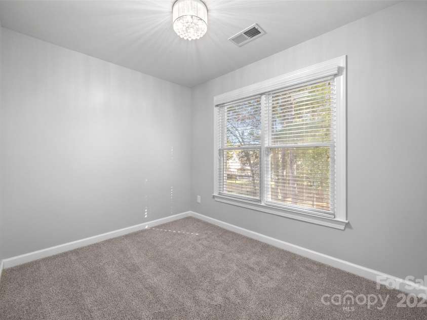 7146 Harcourt Crossing, Indian Land, SC 29707.  MLS# CAR4313502, YatesRealty ID 25914. Primary Suite sitting area facing the back yard