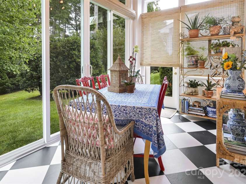 43 Towne Place Drive, Hendersonville, NC 28792.  MLS# CAR4276798, YatesRealty ID 25921. Sunroom with sliding glass doors and side exit