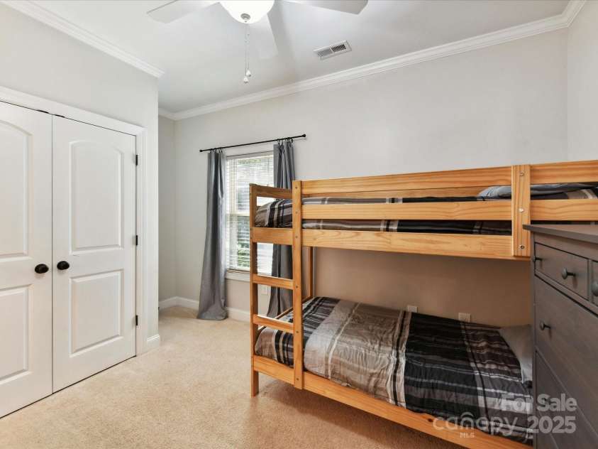 3801 Creek Ridge Drive, Denver, NC 28037.  MLS# CAR4258804, YatesRealty ID 25922. Bedroom 2 with crown molding & ceiling fan/light on upper level!