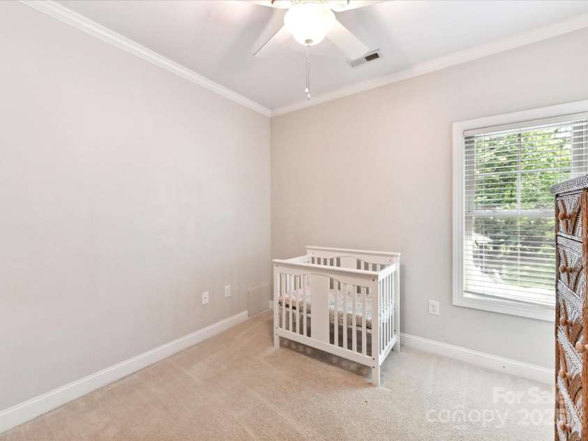 3801 Creek Ridge Drive, Denver, NC 28037.  MLS# CAR4258804, YatesRealty ID 25922. Bedroom 3 with crown molding, ceiling fan/light & built in shelving!