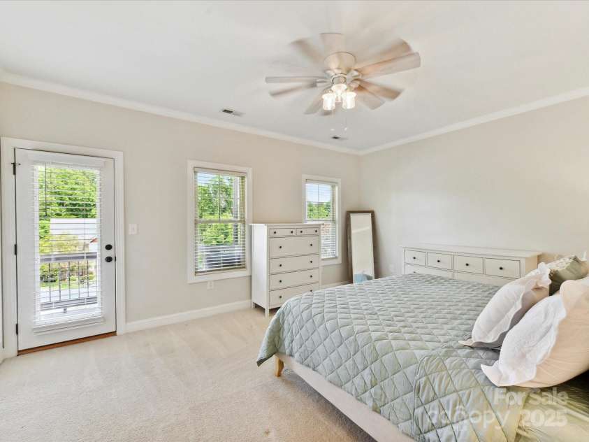 3801 Creek Ridge Drive, Denver, NC 28037.  MLS# CAR4258804, YatesRealty ID 25922. Spacious Primary Suite on upper level with crown molding, private, covered balcony, ceiling fan/light, private bath & walk in closet!