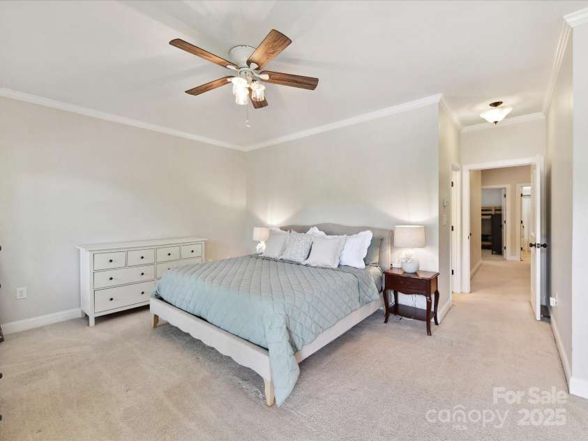 3801 Creek Ridge Drive, Denver, NC 28037.  MLS# CAR4258804, YatesRealty ID 25922. Spacious Primary Suite on upper level with crown molding, private, covered balcony, ceiling fan/light, private bath & walk in closet!