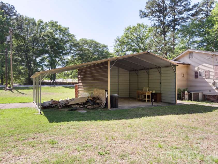 5208 Hickory Grove Road, Mount Holly, NC 28120.  MLS# CAR4369227, YatesRealty ID 25924. Carport