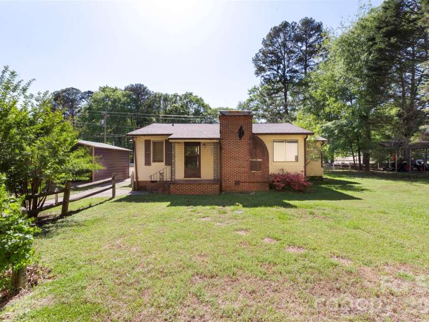 5208 Hickory Grove Road, Mount Holly, NC 28120.  MLS# CAR4369227, YatesRealty ID 25924. Main house back view