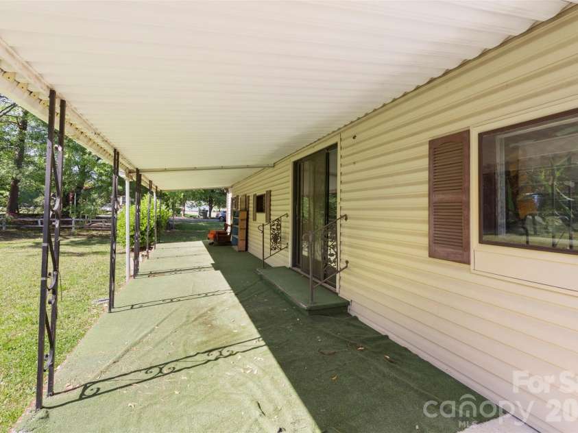 5208 Hickory Grove Road, Mount Holly, NC 28120.  MLS# CAR4369227, YatesRealty ID 25924. Main house front porch
