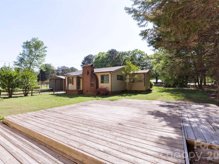 5208 Hickory Grove Road, Mount Holly, NC 28120.  MLS# CAR4369227, YatesRealty ID 25924. Main house view from deck