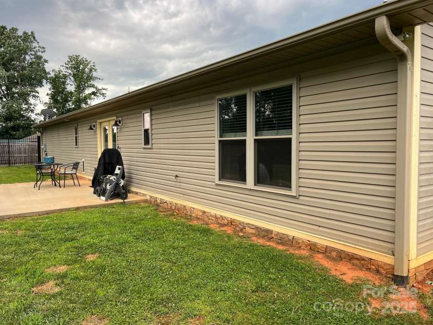 58 Mary's Lane, Marion, NC 28752.  MLS# CAR4274922, YatesRealty ID 25926. Back of house