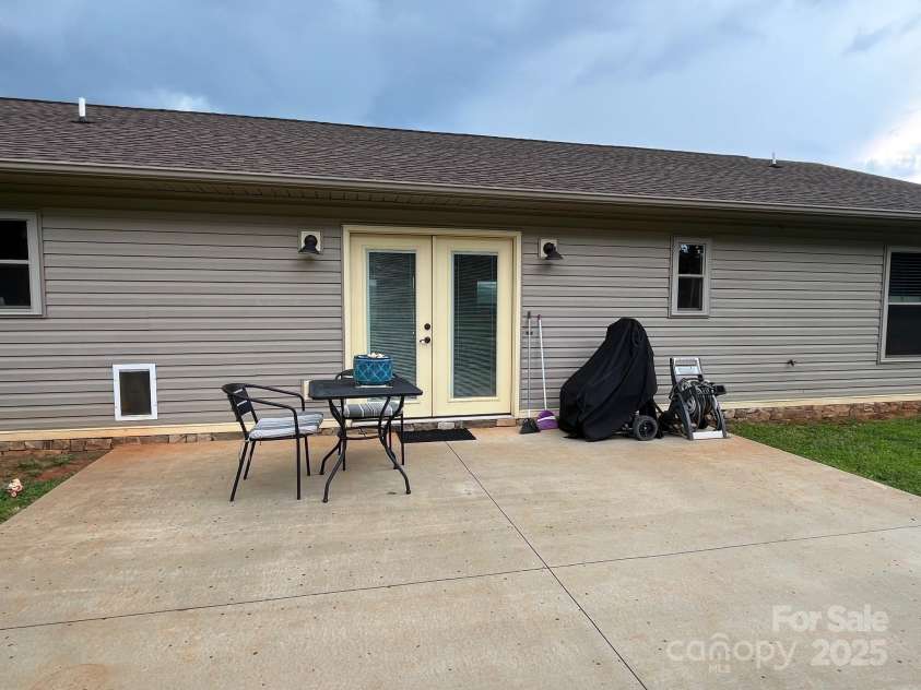 58 Mary's Lane, Marion, NC 28752.  MLS# CAR4274922, YatesRealty ID 25926. Large back patio