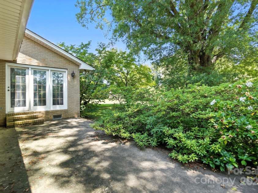 13909 Idlewild Road, Matthews, NC 28105.  MLS# CAR4272282, YatesRealty ID 25933. Back patio