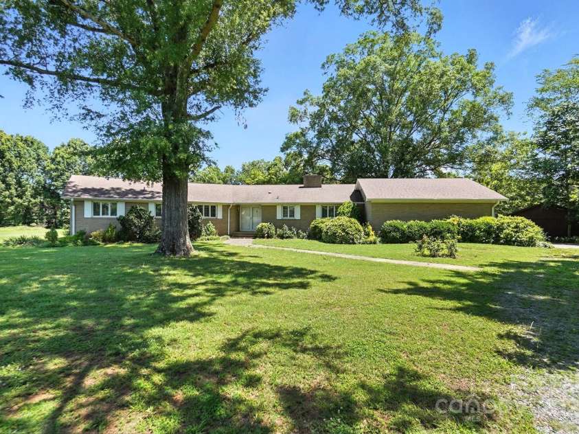 13909 Idlewild Road, Matthews, NC 28105.  MLS# CAR4272282, YatesRealty ID 25933. Front yard