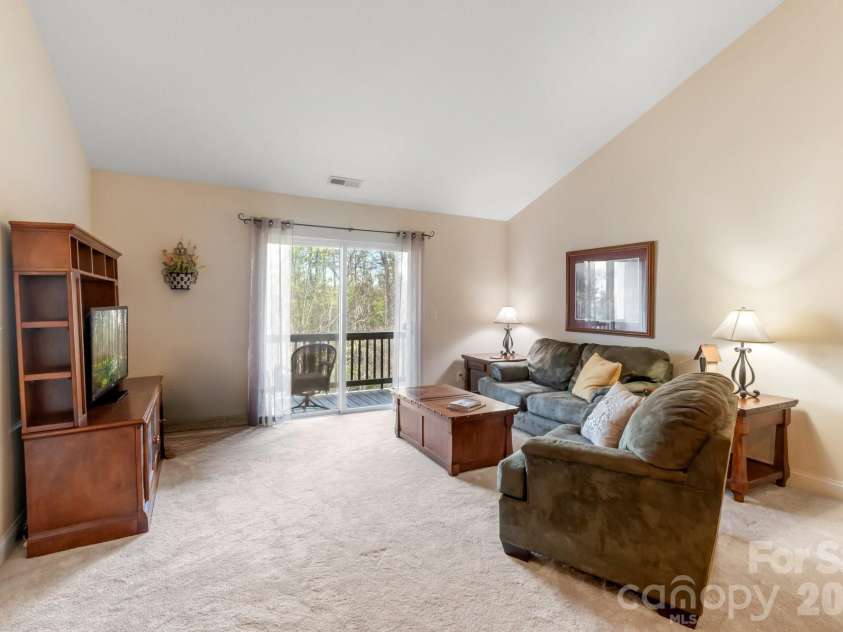 94 Foxden Drive, Fletcher, NC 28732.  MLS# CAR4364312, YatesRealty ID 25941. Look at all the space!  And easy access to the back deck!
