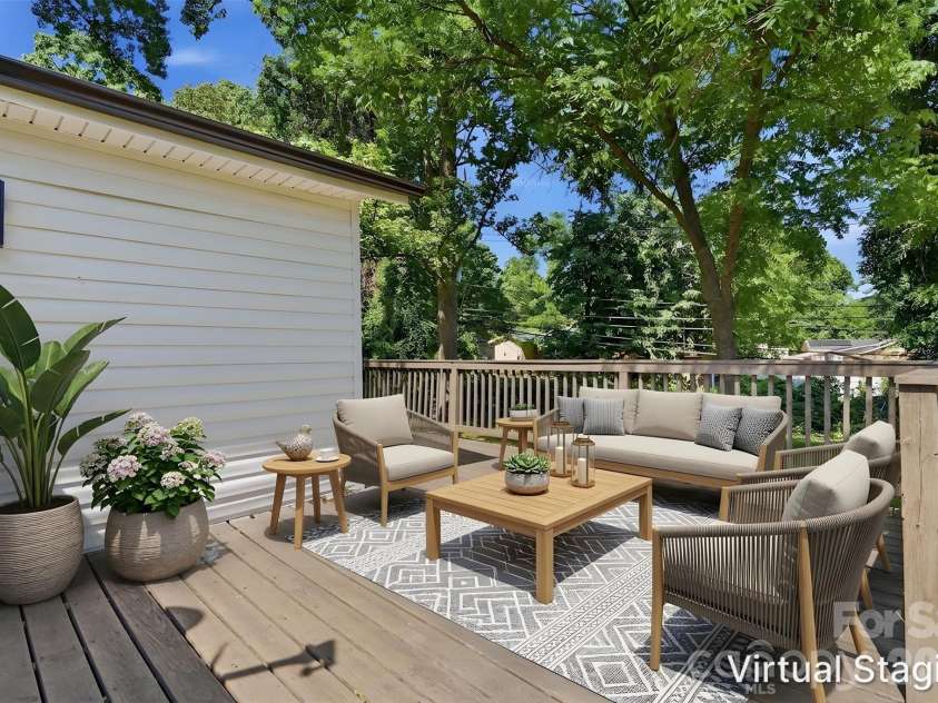 810 Echo Glen Road, Charlotte, NC 28213.  MLS# CAR4386453, YatesRealty ID 25944. Check out this massive wraparound deck!! (Virtually staged & enhanced).