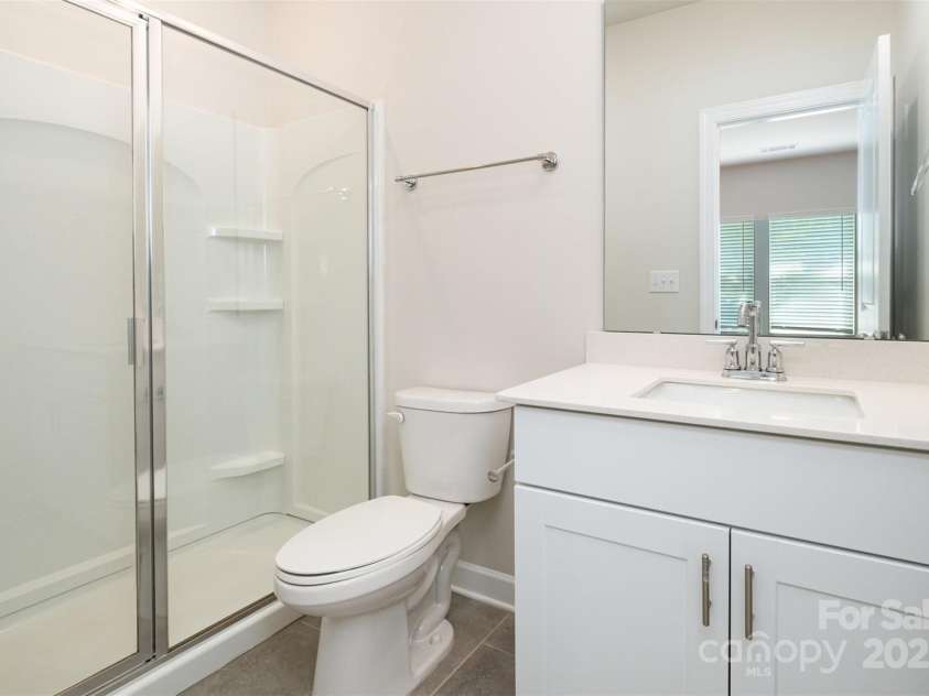7012 Bryce Avenue, Charlotte, NC 28217.  MLS# CAR4269168, YatesRealty ID 25946. Downstairs bedroom/office ensuite bath