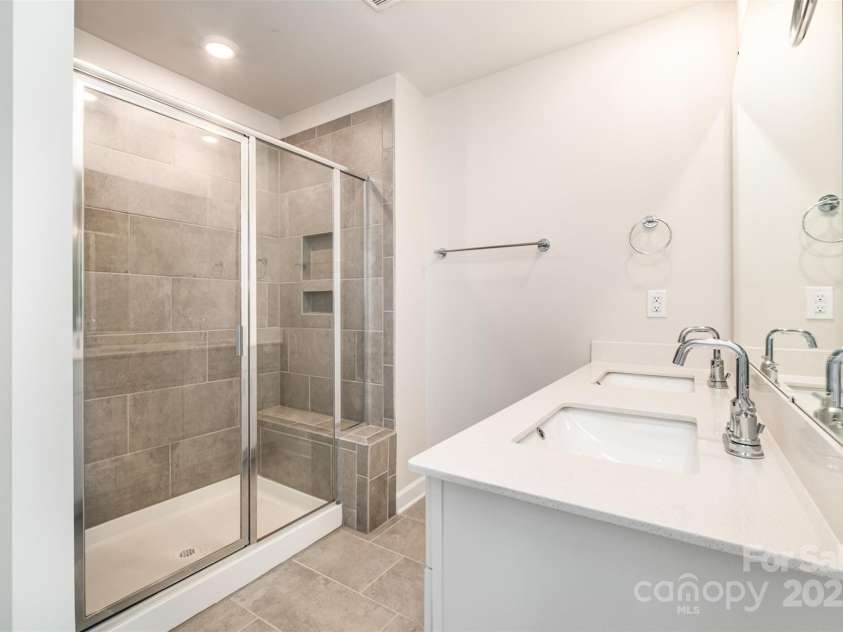 7012 Bryce Avenue, Charlotte, NC 28217.  MLS# CAR4269168, YatesRealty ID 25946. Primary bath with dual vanities