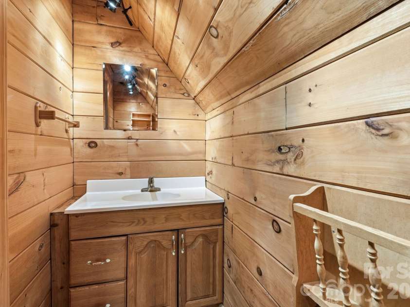 98 Sparkling Springs Road, Fairview, NC 28730.  MLS# CAR4376359, YatesRealty ID 25953. Half Bath